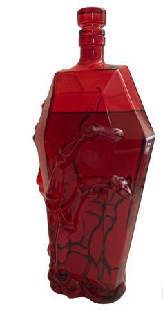 a red glass bottle with an animal design on it