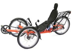 an orange three wheeled bike with black seat and backrests, on a white background