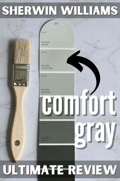 a paint brush with the words comfort gray on it and an image of two different colors