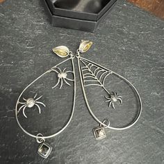 The Itsy Bitsy Spider Hoops, Featuring Golden Amber And Flashy Pyrite. These Babies Are Lightweight And Each Feature Hand Forged Spiders And Spiderweb. Hand Forged 100% Sterling Silver And Fine Silver Purchased Online At Thunder And Anvil Spiderweb Jewelry, Spiderweb Chain, Spider Earring, Spider Jewelry Vintage, Itsy Bitsy Spider, Spider Jewelry, Golden Amber, Hand Forged, Online Purchase