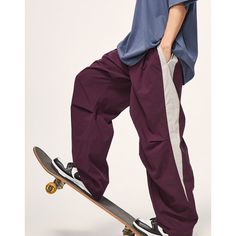 a man riding a skateboard on top of a wooden boarder's leg