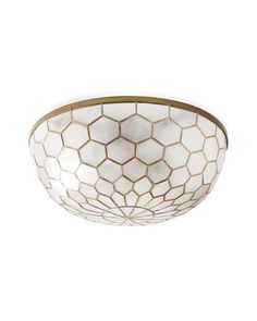 a white ceiling light with gold trim and hexagonal design on the glass bowl