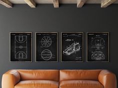 three black and white drawings hang on the wall next to a brown couch in a living room