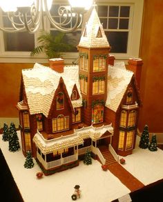 a large gingerbread house with lights on