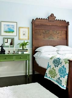 an image of a bedroom with blue walls and green furniture on the bottom right hand corner