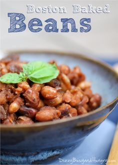 a blue bowl filled with beans on top of a table