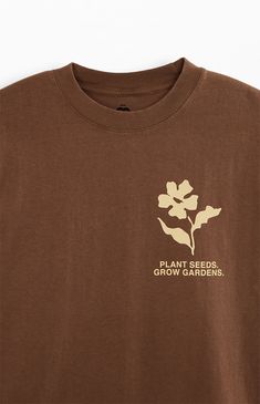 The Garden & Seeds Mission Co-Op T-Shirt blends timeless design with a distinct touch. This tee features a crew neckline, short sleeves, a standard fit, and a vintage wash, complemented by custom branding on both the front and back, making it a versatile and stylish addition to your collection.   	Crew neckline 	Short sleeves 	Standard fit 	Vintage wash 	Front & back graphics 	Machine washable Farm T Shirt Designs, Monochromatic T Shirt Design, Random Tshirt Designs, Made In The 90s Shirt, Corporate Tee Shirt Design, T Shirt Collage Design, Cute Screen Printed Shirts, Cottage Core T Shirt, Earthy Graphic Tees