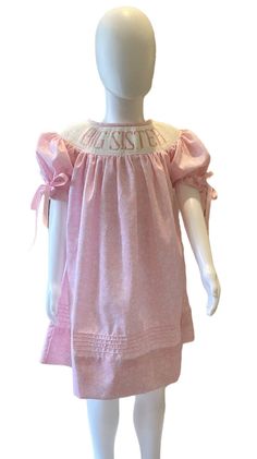 A beautiful hand smocked heirloom floral dress. The smocked sleeves complete the beautiful dress. The warm pink fabric is perfect for year  round wear. Your little one will look like a princesses when she wears this special dress. The perfect dress to announce a new addition to your family! Pink Cotton Dress With Gathered Sleeves, Pink Smocked Puff Sleeve Dress, Pink Smocked Dress With Puff Gathered Sleeves, Pink Smocked Dress With Puff Sleeves And Gathered Details, Pink Bishop Sleeve Dress With Gathered Sleeves, Cute Pink Smocked Dress With Smocked Back, Pink Smocked Dress With Puff Sleeves For Daywear, Pink Smocked Dress With Gathered Sleeves For Spring, Spring Pink Smocked Dress With Gathered Sleeves