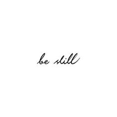 the word be still written in cursive writing on a white background with black ink