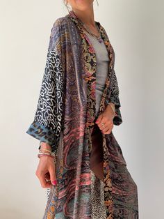 "This is super stylish kimono robe made patchwork of varieties silky materials It is in free size with wrap tie closing, with smal splits on the side easy fit all ladies, feels very comfortable and light Can be used as an everyday robe or boho street style over all with jeans and t shirt It is made one of a kind, patchwork from varieties of different floral silky materials MEAESURE shoulder 17\" length 55\" MATERIAL *poliester, no lining CARE INSTRUCTIONS * Wash in warm water * Hand wash recomme Multicolor Wrap Kimono With Patchwork, Oversized Multicolor Wrap Kimono, Long Multicolor Floral Embroidered Kimono, Multicolor Patchwork Robe With Kimono Sleeves, Multicolor Patchwork Wrap Kimono, Multicolor V-neck Kimono For Loungewear, Multicolor Long Sleeve Printed Robe, Boho Street Style, Multicolor Long One-size Kimono