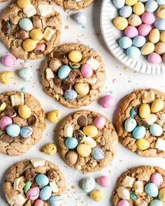 chocolate chip cookies decorated with mini eggs and m & m's on a plate