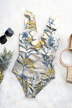 Luxury One-piece Swimwear For Poolside, Affordable Trendy One-piece Swimwear, Affordable Summer One-piece For Vacation, Elegant Luxury Printed Swimwear, Luxury Chic Swimwear For Summer, Luxury Elegant Floral Print Swimwear, Luxury Summer Swimwear For Poolside, Luxury Spring Bodysuit For Poolside, Luxury Printed Swimwear For Spring