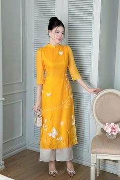 Very elegant design Elegant Fitted Ao Dai For Summer, Elegant Fitted Ao Dai For Spring, Fitted Elegant Ao Dai For Spring, Yellow Silk Dress With Short Sleeves, Elegant Long Ao Dai For Summer, Elegant Summer Ao Dai For Party, Elegant Ao Dai For Summer Parties, Yellow Long Midi Dress For Spring, Long Yellow Midi Dress For Spring