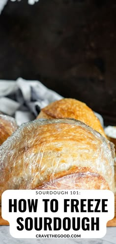 some bread is sitting on a table with the words how to freeze sourdough