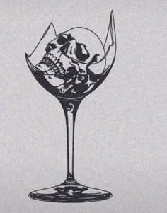 a drawing of a wine glass with skulls and bones in the bottom, on a white background