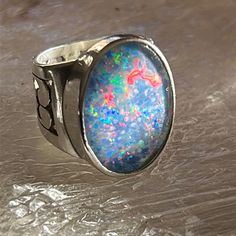 Unisex Ring Features Stunning Opal Triplet; This Ring Is Large And In Charge!!!!! Lots Of Fire And Spark. Handcrafted Artisan - Unique! Artisan Silver Opal Cabochon Ring, Silver Opal Fusion Jewelry, Handmade Silver Opal Ring For Formal Occasions, Silver Fusion Opal Ring For Anniversary, Silver Fusion Style Opal Ring For Anniversary, Handmade Blue Opal Rings, Blue Opal Ring In Sterling Silver, Spiritual Style, Rings Opal, M Jewelry