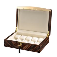 an open wooden watch box with six watches inside