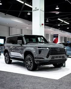 an suv is on display in a showroom