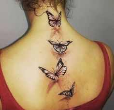 the back of a woman's neck with three butterflies on her left side, and two