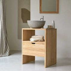 a bathroom with a sink and mirror in it