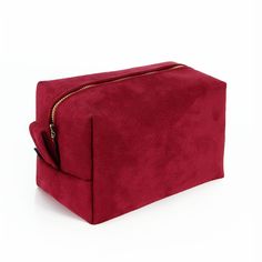 Womens travel toiletry bag We designed this chic toiletry bag bag thinking about stylish and classy women, who appreciate classy elegance and good design.  As the outer fabric we have used finest vegan suede, which feels like velvet, in deep crimson red. We have lined it inside with an impregnated polyamid fabric, that is waterproof and also very easy to clean. There are three pockets on the sides, that will help to organize all the little accessories. This unique cosmetic bag opens and closes with a brass zipper of a golden shade. Its size is 19x11x11cm. - it will fit all the essential cosmetics necessary for a weekend travel or longer journeys. However it is still so compact that it won't take too much space in your suitcase, weekender bag or a backpack. Outer fabric has a special formul Cheap Red Cosmetic Bag With Zipper, Red Makeup Bag, Designer Makeup Bag, Designer Makeup, Travel Toiletry Bag, Makeup Holder, Vegan Cosmetics, Red Makeup, Sac Week End