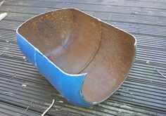 two blue pots sitting on top of a metal grate next to a banana peel