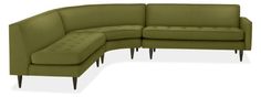 the corner sofa is made from green fabric and has two footstools on each side