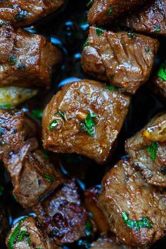 closeup of cooked meat with herbs on it