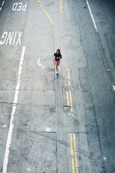 an aerial view of a person walking down the street