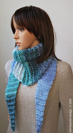 a mannequin wearing a blue and white scarf