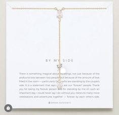 a card with a chain attached to it that says by my side