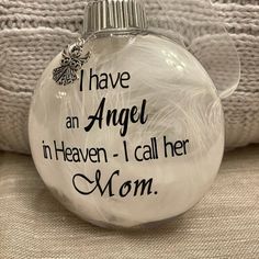 a glass ornament with the words i have an angel in heaven call her mom