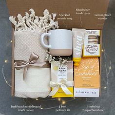 the contents of a gift box for someone who likes to have coffee, tea, and other goodies