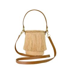 Frayed Mini Bucket 100% Toquilla Straw. This material is known for its quality and beauty. Each bag is entirely hand-made, from the straw dye to the weaving of the bag. -Measures approximately High: 15 Cm Width: 11 Cm Handle: 14 Cm - We ship with DHL Express. Shipping takes approximately 3 to 5 days to arrive depending on the destination. -Need Help? Please contact: customercare@sensistudio.com -All Sales Are Final. Evening Beige Bucket Bag With Braided Handles, Evening Bag In Natural Woven Leather, Evening Bags In Woven Leather Natural Color, Evening Bag With Woven Leather In Natural Color, Leather Bucket Bag With Bamboo Handle In Natural Color, Natural Leather Bucket Bag With Bamboo Handle, Evening Woven Leather Bag In Natural Color, Beige Leather Basket Bucket Bag, Chic Light Brown Bucket Straw Bag