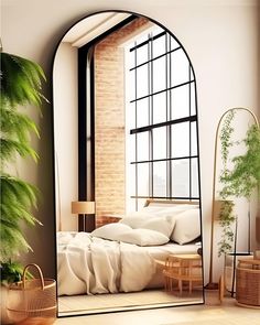 an arched mirror in the corner of a room with a white bed and pillows on it