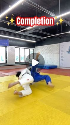 a person on a yellow mat with a white object in their hand and the words competition written above it