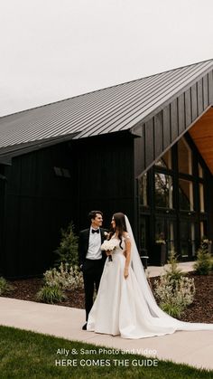 a bride and groom standing in front of a black building with the words, here comes the guide