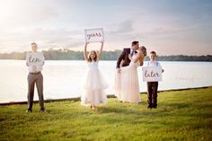 a group of people standing next to each other holding signs that say yes and less