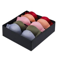 six different colored bras in a black box