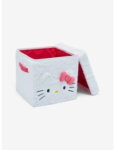 a white hello kitty storage box with a pink bow on the top and red lining