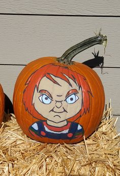 two pumpkins that have been carved to look like cartoon characters, one with red hair and the other with blue eyes