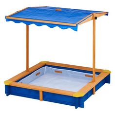 a blue and yellow play table with an umbrella over it's top, on a white background