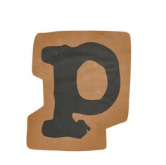 the letter q is made out of cardboard and has black letters on it, with a brown background