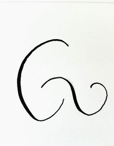 the letter g is drawn with black ink on white paper and has a curved tail