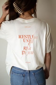 Introducing our "Restless Until I Rest in You" Christian Shirt - a garment designed to inspire and uplift, combining comfort with a powerful message of faith. Crafted from the softest materials, this shirt is not just a piece of clothing; it's a statement of your unwavering trust. This tee serves as a constant reminder of the profound peace that comes from surrendering. Whether you're heading to worship, spending time in quiet reflection, or simply going about your day, this shirt is a tangible Fun T Shirt Ideas, Christian Shirts Designs Aesthetic, Conference Tshirt Design, Cool Christian Shirts, Christian Graphic Tees Design, Tshirt Merch Design, Church Merch Ideas, Church Tshirt Designs, Christian Shirt Ideas