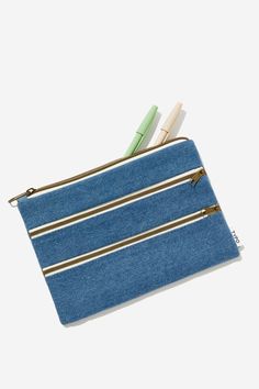 Features:   -  Zip Closure -  Lined Interior -  One Main Compartment With Two Front PocketsComposition: Cotton 100%Typo - Double Campus Pencil Case - Light Blue DenimTypo | Travel & Tech | Bags & Totes | Pencil CasesTypo | Travel & Tech | Bags & Totes | Pencil CasesTypo | Travel & Tech | Bags & Totes | Pencil Cases Trendy Pencil Case With Zipper Closure For Everyday, Trendy Everyday Pencil Case With Zipper, Blue Pencil Case With Zipper For School, Blue Pencil Case With Zipper Closure, Casual Pencil Case With Pen Slots For Everyday, Casual Zipper Pouch Pencil Case For Daily Use, Casual Rectangular Pencil Case For Everyday Use, Casual Rectangular Pencil Case, Trendy Blue Pencil Case With Pen Holders