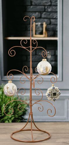 a metal stand with ornaments on it