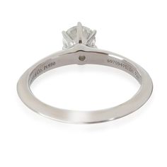 Tiffany & Co. Diamond Engagement Ring in  Platinum G VS1 0.52 CTW  PRIMARY DETAILS  SKU: 140734  Listing Title: Tiffany & Co. Diamond Engagement Ring in  Platinum G VS1 0.52 CTW  Condition Description: Tiffany reinvents a classic with the Return To Tiffany collection. Originally designed in 1969, the Tiffany keyring is the source of inspiration behind this line-up, which is defined by its engraved heart-shaped pendant.     Retails for 6750 USD. In excellent condition and recently polished. Ring size is 6. Comes with Box;Valuation Report;  Brand: Tiffany & Co.  Collection/Series: The Tiffany Setting  Metal Type: Platinum  Metal Purity: 950  Ring Size: 6  Pre-Owned Jewelry Condition: Excellent  CENTER STONE INFORMATION  Center Stone Weight 1 (cts): 0.52  Center Stone 1 Color: G  Center Stone Timeless Engagement Ring Tiffany & Co., Tiffany Engagement Ring Erstwhile Jewelry, Tiffany Engagement Ring Tiffany & Co., Tiffany Solitaire Ring Tiffany & Co., Tiffany And Co Lock Ring, Tiffany Setting, Return To Tiffany, Gemstone Solitaire Ring, Sapphire Solitaire Ring