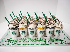 starbucks cupcakes with white frosting and sprinkles are arranged in a row