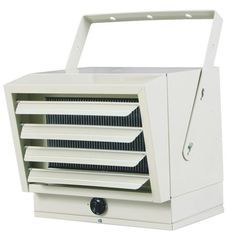 a white electric heater sitting on top of a table